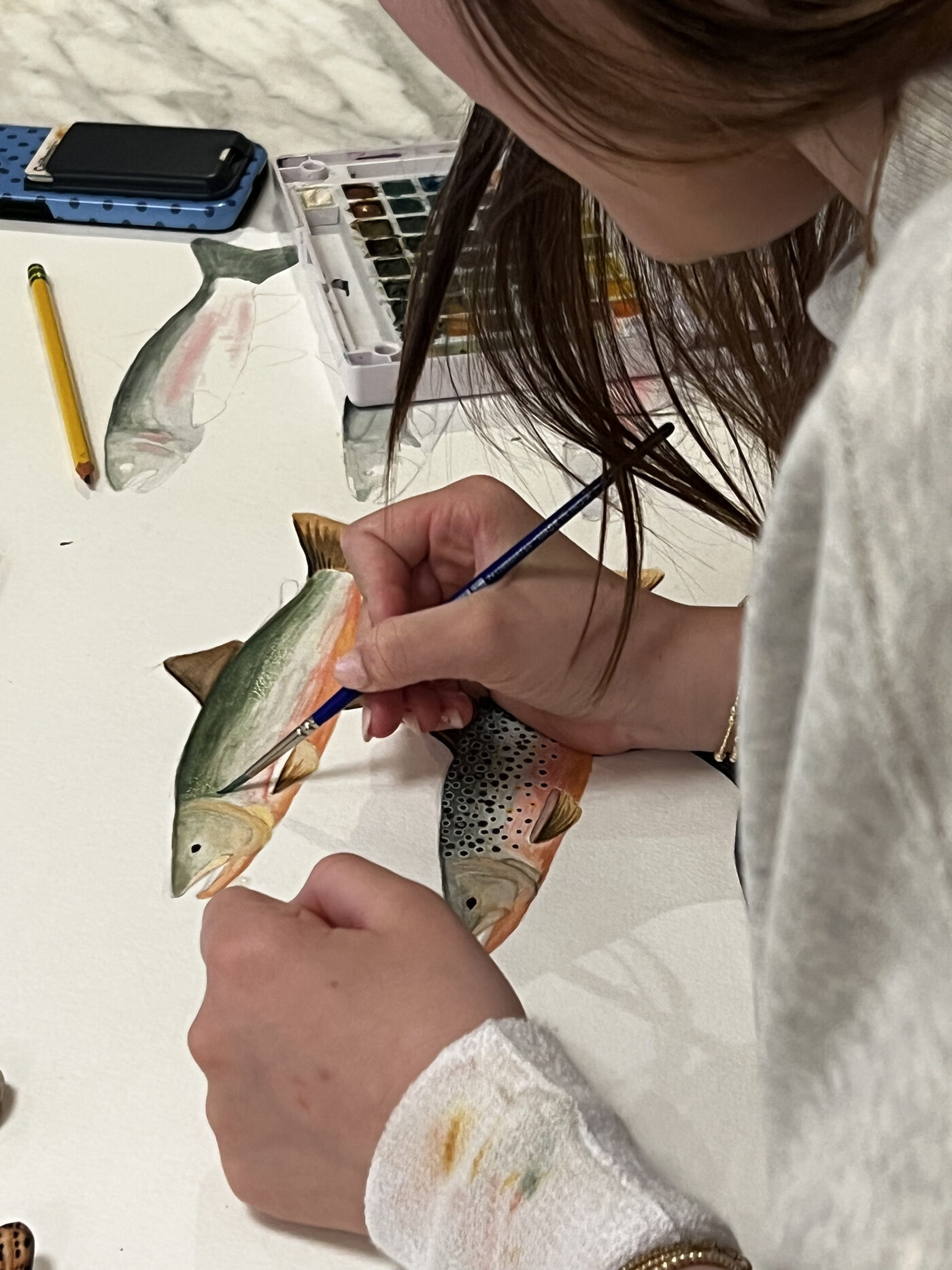 Lindsay Lee painting in her studio